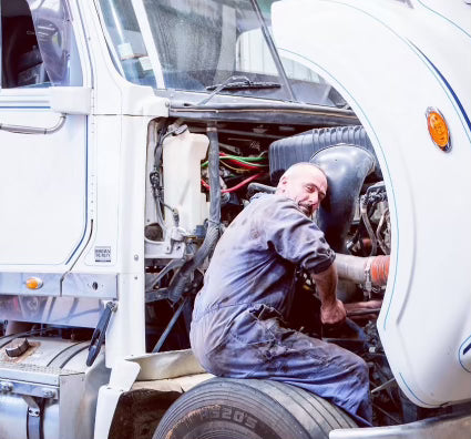 Ian Miller, Mechanic working on a truck engine